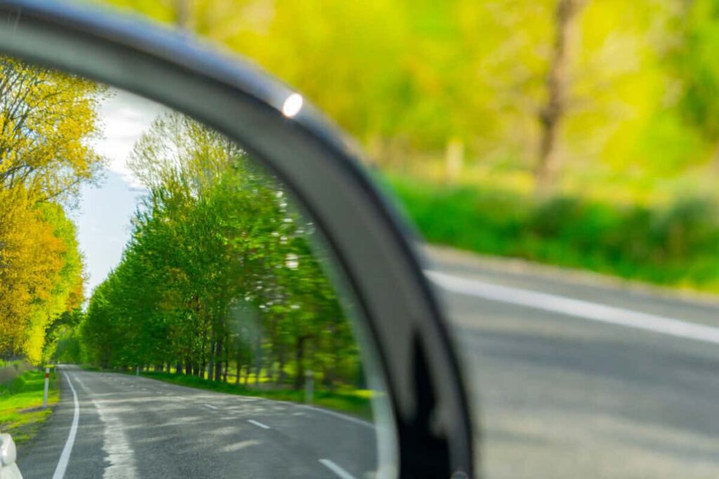 Billionaires Are Bucking the Nvidia Trend, and Now This Stock Looks Ideal looking backward in car mirror